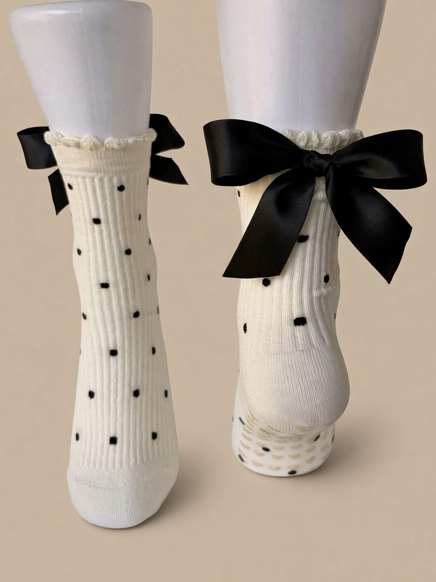Ivory polka dot socks with black satin bows